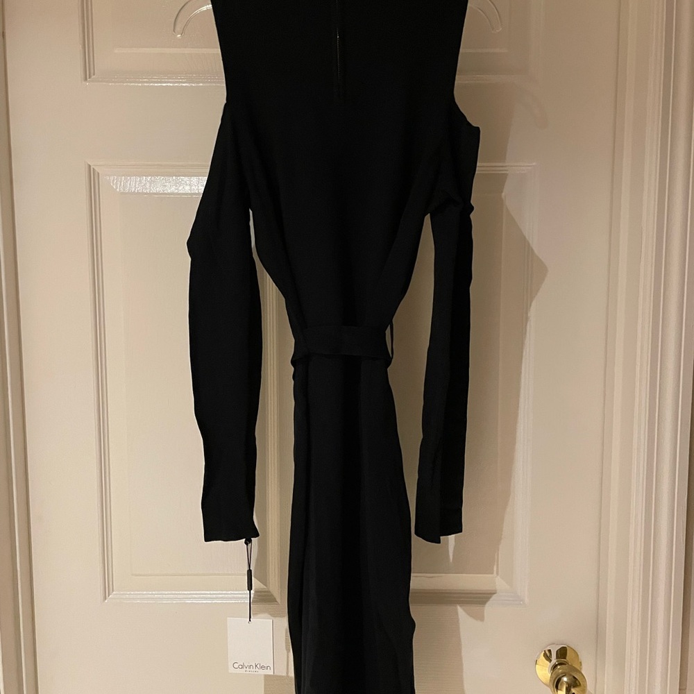 Black ribbed mock neck cold shoulder midi dress.  Brand new.  Size small.